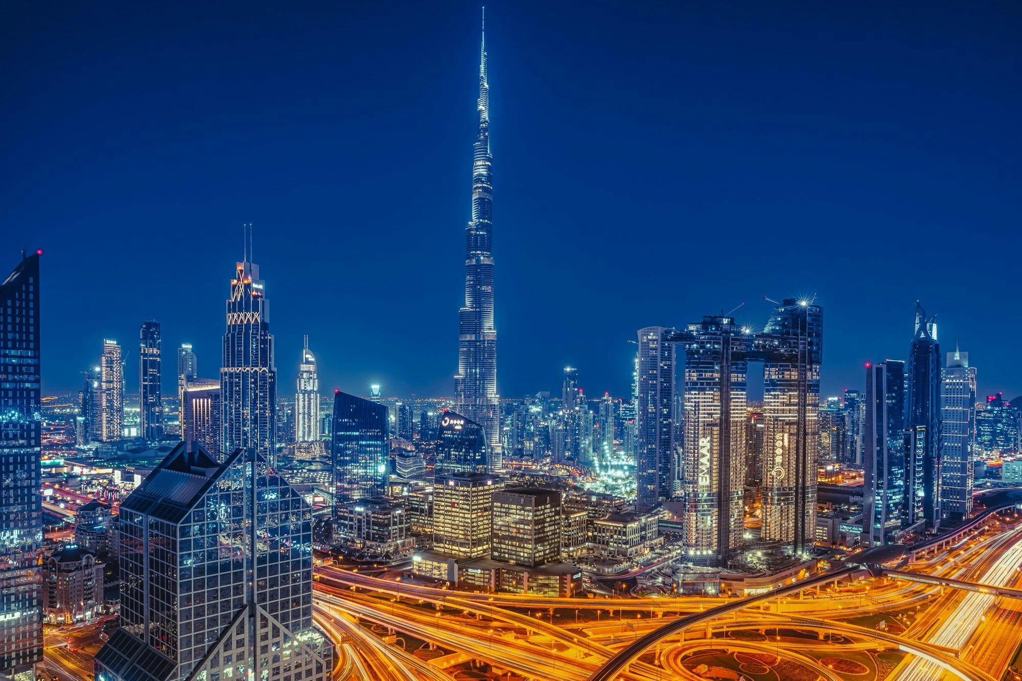 The Burj Khalifa above the illuminated Dubai skyline at night, where AI Overviews now answer Arabic searches