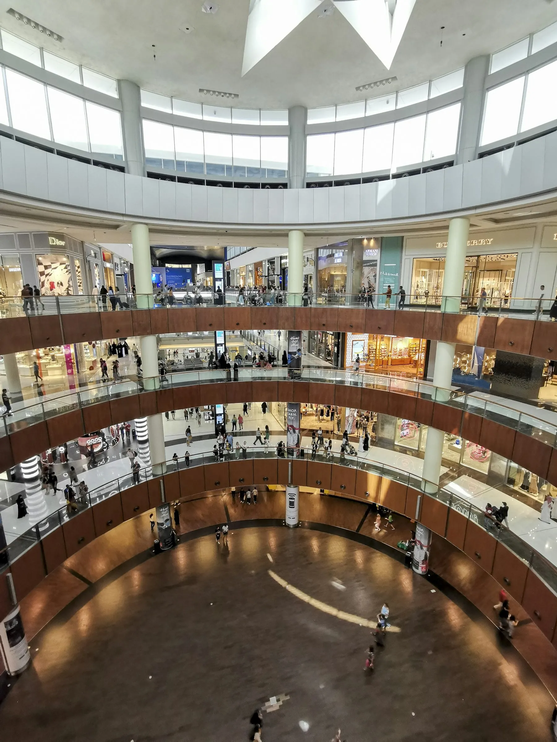 Shoppers walking through a mall from above, the audience marketplace SEO now reaches online