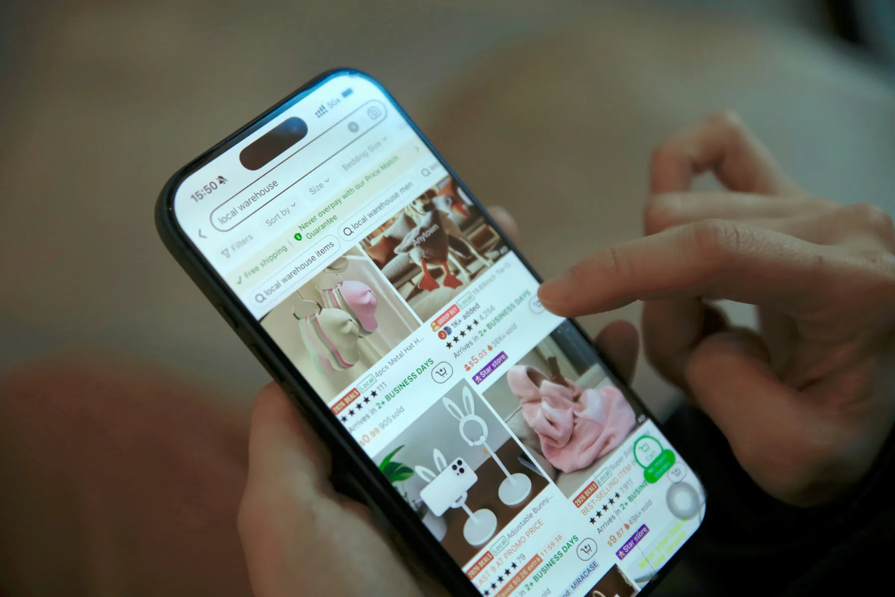 A person scrolling an online shop on a phone, shaped by product page SEO