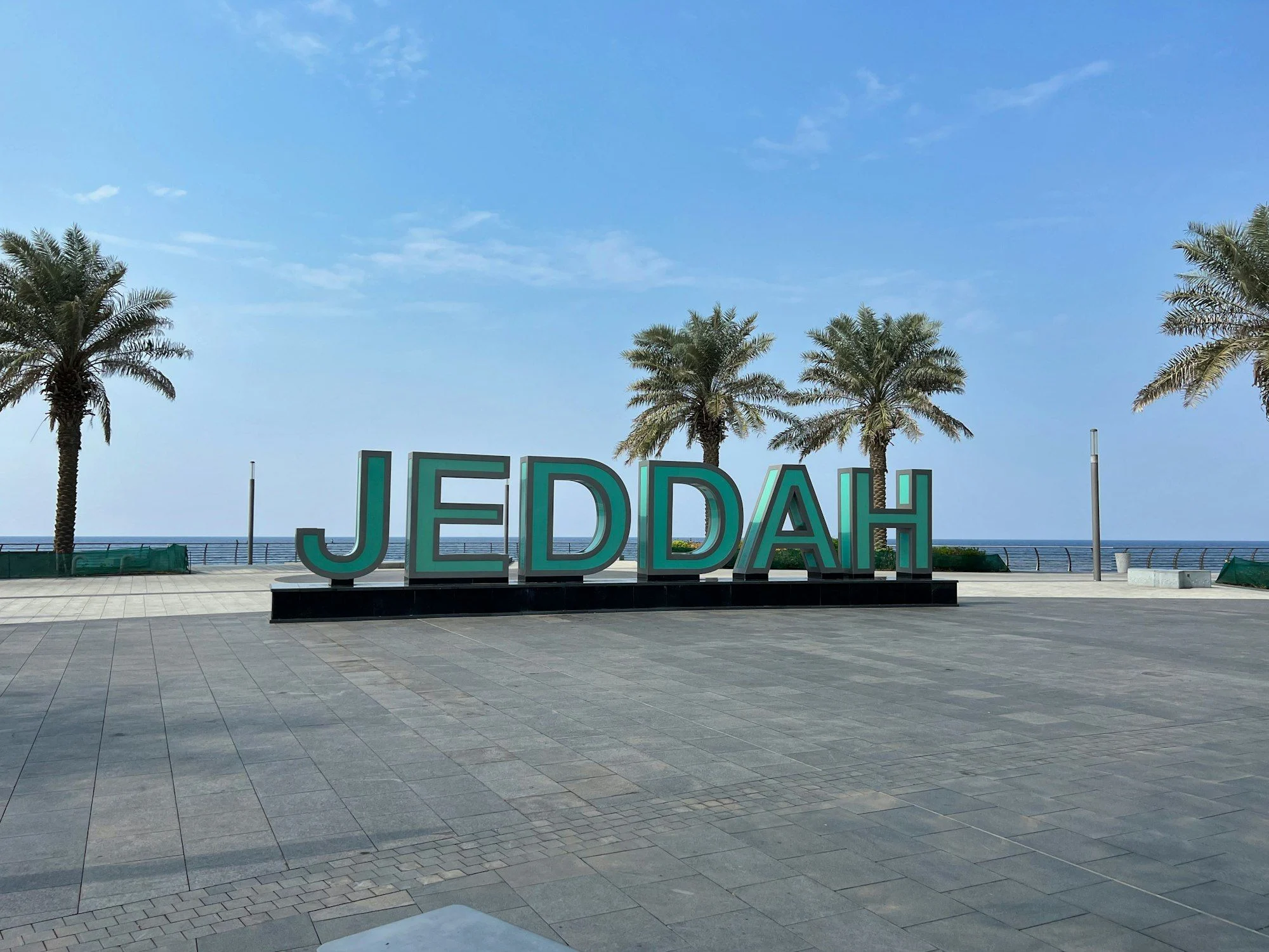 A large sign that says Jeddah in front of palm trees, representing Google Ads Saudi campaigns