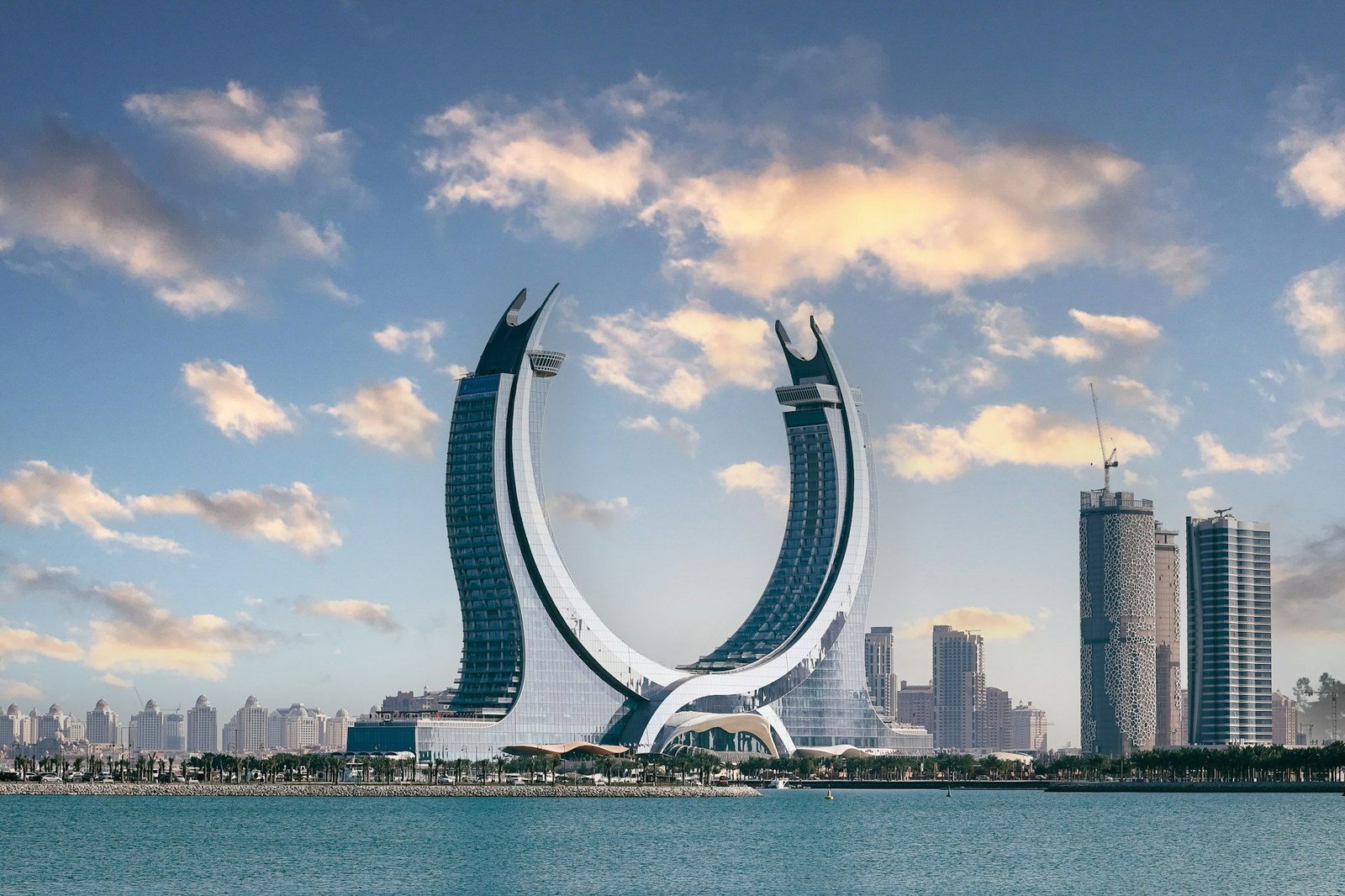 The crescent-shaped Katara Towers above the waterfront in Lusail, Qatar